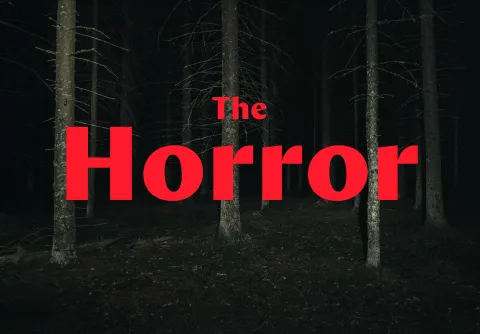 Mörk skog och texten The Horror